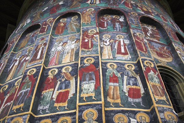 ROMANIA, Moldavia, Bucovina, "Several colourful frescoes on outside wall, Sucevita Monastery, Sucevita"