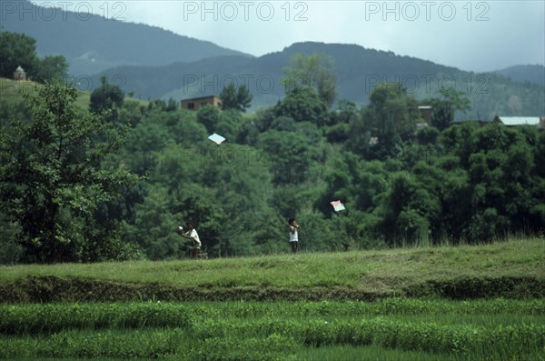 20088794 NEPAL Kathmandu Bhaktapur Boys flying kites  a traditional festival sport.