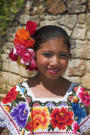 MEXICO, Yucatan, Chichen Itza, Young Mexican girl wearing traditional costume