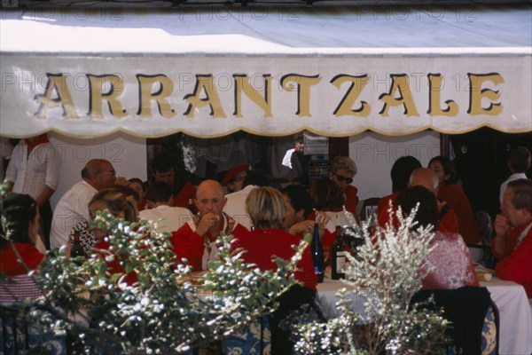 SPAIN, Pais Vasco, Hondarrabia, Cafe with locals and tourists during the annual festival celebrating the defeat of the French during the a siege in 1638ad.