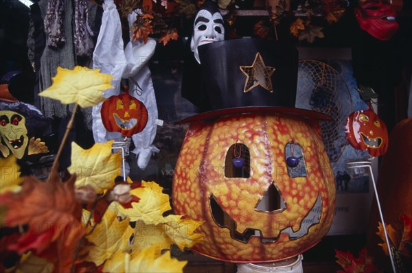 USA, New York, New York City, Display of masks and costumes for Halloween in shop on West 34th Street.