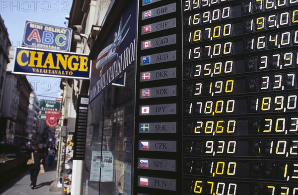 HUNGARY, Budapest, Exchange rates listed outside shop offering money changing service.