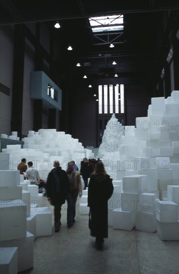 ENGLAND, London, "Tate Modern. Turbine Hall. Exhibition by Rachel Whiteread called Embankment. 14,000 transluscent white polyethylene boxes stacked in various ways. Visitors walking around exhibit."