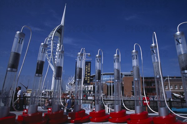 ENGLAND, Hampshire, Portsmouth, "Gunwharf Keys. The Spinnaker Tower, seafood restaurants and bars seen through a large plastic commercial vodka display "