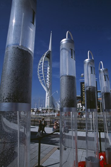 ENGLAND, Hampshire, Portsmouth, Gunwharf Keys. The Spinnaker Tower seen through a large plastic commercial vodka display