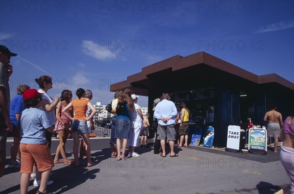 ENGLAND, West Sussex, Littlehampton, "People queuing at the East Beach Cafe, a seafront structure designed by Thomas Heatherwick"