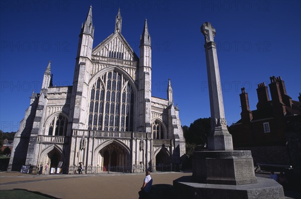 ENGLAND, Hampshire, Winchester, Winchester Cathedral. West elevation with war memorial in the foreground