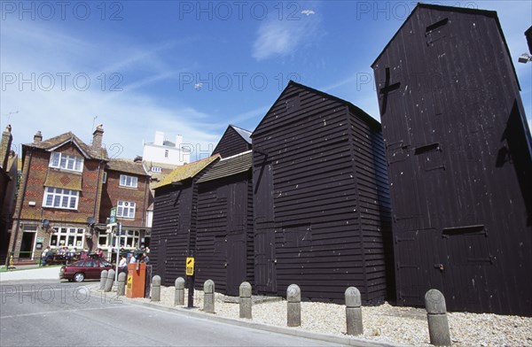ENGLAND, East Sussex, Hastings, "Tall black wooden huts close to the Fishermens Museum, originally used as workshops and storage for nets, sails and ropes"
