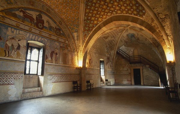 ITALY, Lombardy, Lake Maggiore, Angera.  Interior of reception hall in Rocca di Angera medieval castle with painted vaulted ceiling and fresco wall decoration.