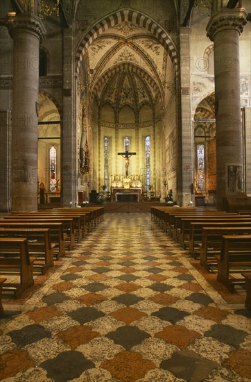 ITALY, Veneto, Verona, "Interior of Church Sant’Anastasia dating from the thirteenth century.  Painted vaulted ceiling, altar and crucifix, rows of pews on red, black and white patterned floor."