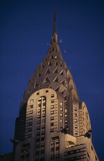 USA, New York, New York City, Part view of the Chrysler Building from Lexington Avenue.  Steel framed Art Deco skyscraper built 1928-1930.  Designed by architect William Van Alen.