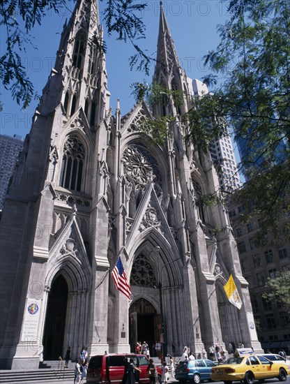 USA, New York, Saint Patrick’s Cathedral located on 5th Avenue framed by tree branches