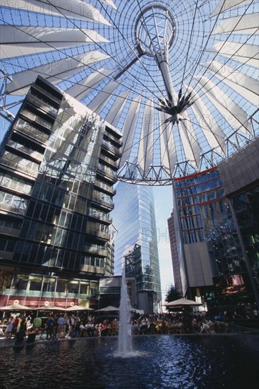 GERMANY, Berlin, Potsdamer Platz interior with crowds gathered around water fountain