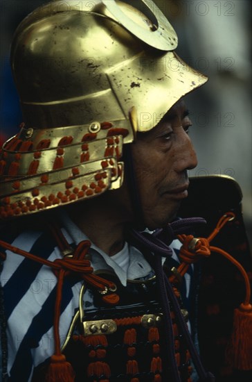 JAPAN, People, Samurai, "Portrait of Samurai wearing armour constructed of plates of metal or bamboo held together with coloured lacing,  intended to be elegant in appearance while still giving protection from arrows and sword thrusts during battle."