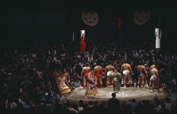 JAPAN, Samurai, Sumo, Sumo wrestlers of the top division perform the dohyo-iri ring entry ceremony before crowd of spectators before a Grand Championship fight.