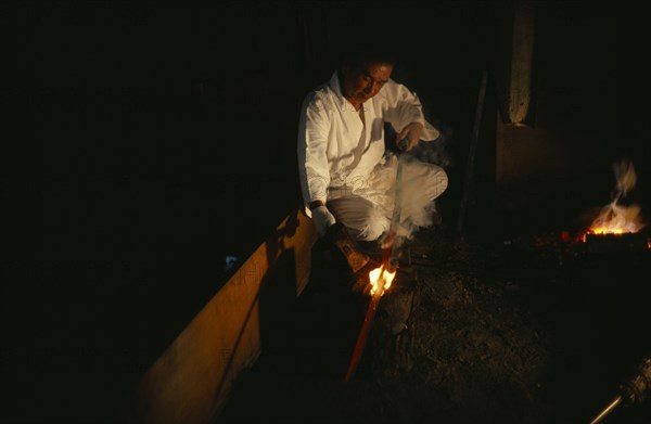 JAPAN, Samurai, Swordsmith, "The swordsmith Gassan Sadakazu given the honour of being classified a Human National Treasure, photographed aged seventy-three years old working in the family tradition of swordmaking.  In fuedal times the sword was the symbol of samurai potency and swordsmiths given high samurai status."