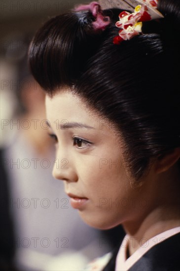 JAPAN, Honshu, Tokyo, "Portrait of actress in scene from popular television series set in the Edo period (1603-1868).  Head and shoulders, three-quarter profile to left."