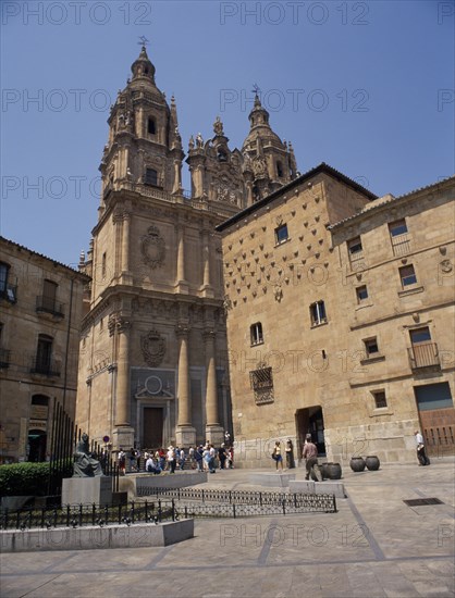 SPAIN, Castille Leon, Salamanca, La Cerica Church and House of Shells Library with visitors gathered at the steps