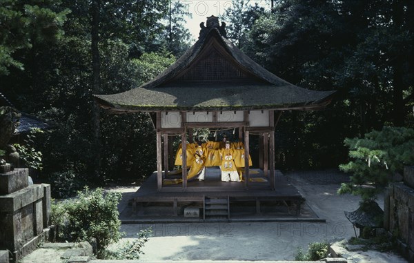JAPAN, Honshu, Kyoto, "Sagimori Shrine.  Bugaku has been preserved for over a thousand years by courtiers of the Imperial Palace, normally performed exclusively by men, these girls dressed in traditional yellow costume, are amateurs performing the old dances chiefly for their own amusement. "