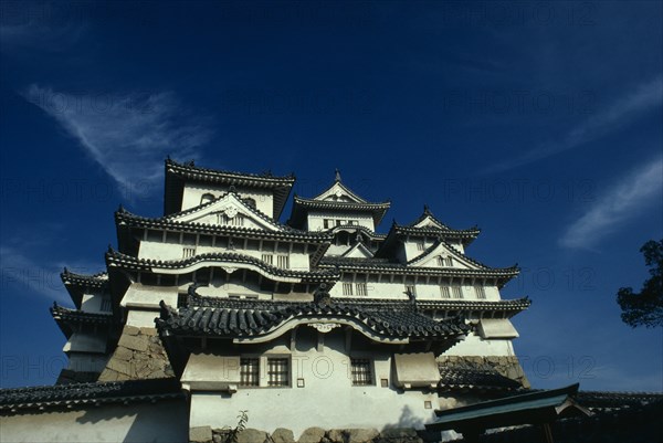 JAPAN, Honshu, Himeji, "Himeji-jo also known as Shirasagi-jo, the white egret or white heron castle.  Feudal castle built by Hideyoshi in 1581, a civil war baron or sengoku daimyo who had risen from the ranks of foot soldier and acquired status.  Central donjon or keep known as tenshu-kaku, the high structure of the heavenly protector. "