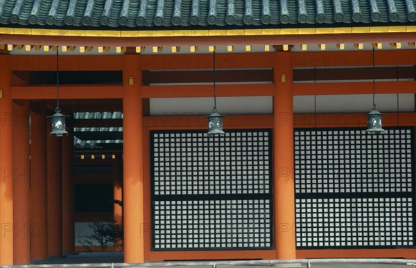 JAPAN, Honshu, Kyoto, "Exterior detail of the Heian shrine, built in 1895 to celebrate the 1100th anniversary of the founding of the city.  Its buildings are a replica on a reduced scale of the first Imperial Palace built in 794.  Red pillars, green roof tiles and hanging lanterns."
