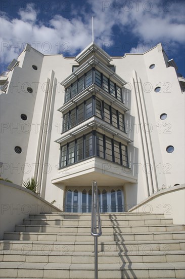 ENGLAND, West Sussex, Worthing, The Warnes modern apartment development. Exterior view of steps leading to front entrance. The building overlooks the Steyne Gardnes and seafront promenade.