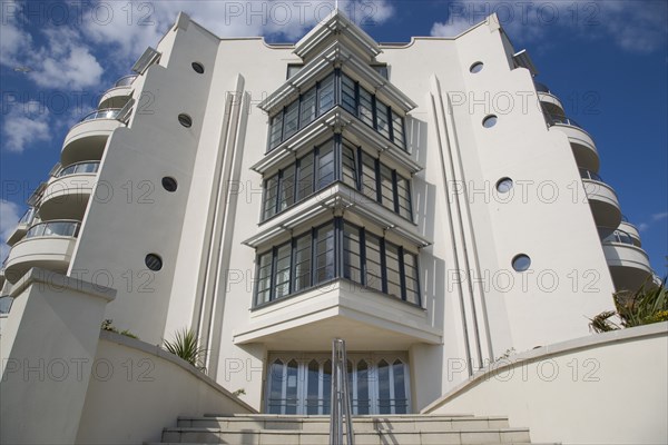 ENGLAND, West Sussex, Worthing, The Warnes modern apartment  development. Exterior view of steps leading to front entrance. The building overlooks the Steyne Gardnes and seafront promenade.