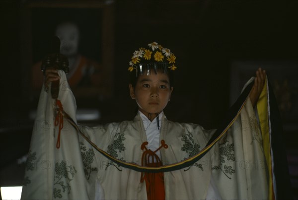 JAPAN, Kyushu, Kaseda Shrine, "Portrait of young shrine maiden employed to welcome visitors, supervise offerings and perform sacred dances for the Shinto gods or kami."