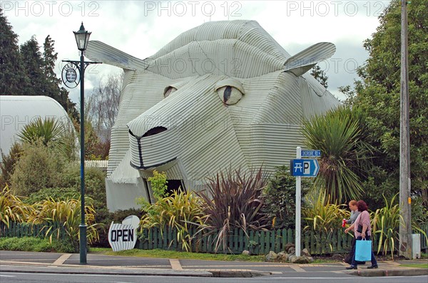 NEW ZEALAND, NORTH ISLAND, WAIKATO, "TIRAU, A CORRUGATED IRON SHEEP WHICH IS A SHEEPSKIN RUG SHOP OFF MAIN STREET IN TIRAU TOWN, SOUTH WAIKATO, NORTH ISLAND. BUILT IN 1994 THIS WAS THE FIRST CORRUGATED ANIMAL STRUCTURE IN THE TOWN WHICH LATER SPAWNED MANY MORE."