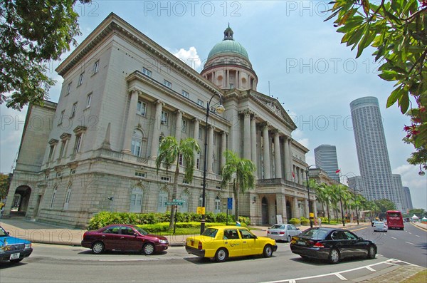 SINGAPORE, OLD SUPREME COURT, "VIEW OF THE OLD SUPREME COURT BUILDING ON THE CORNER OF PARLIMENT PLACE AND ST ANDREWS ROAD. The Old Supreme Court Building is the former courthouse of the Supreme Court of Singapore, before it moved out of the building and commenced operations in the new building on 20 June 2005. The building was the last Classical architecture building to be built on the former British colony. Built in front of the historical Padang grounds between 1937 and 1939, it was designed by Frank Dorrington Ward of the Public Works Department, and was his last and most significant work. The building is planned to become an arts and cultural centre in future, with plans to refurbish the building"