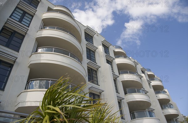 ENGLAND, West Sussex, Worthing, The Warnes modern apartment development. Exterior view of windows and balconys overlooking the seafront.