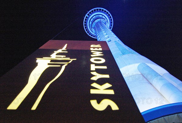 NEW ZEALAND, NORTH ISLAND , AUCKLAND, VIEW OF AUCKLANDS SKY TOWER TAKEN AT NIGHT FROM THE STRUCTURES BASE. IT IS THE TALLEST STRUCTURE IN NEW ZEALAND AT 328 METRES HIGH.