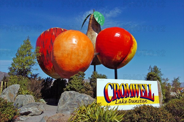NEW ZEALAND, SOUTH ISLAND, CROMWELL, "OTAGO, CROMWELL TOWN SIGN WHICH CONSISTS OF GIANT FIBRE GLASS PEACH, PEAR, APPLE AND ORANGE."