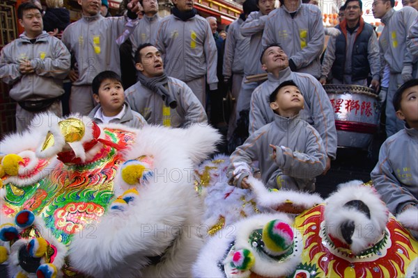 ENGLAND, London, Chinatown,  Lion Dance troupe in Gerrard Street with their lions before performing through the area during Chinese New Year celebrations in 2006 for the coming Year of The Dog