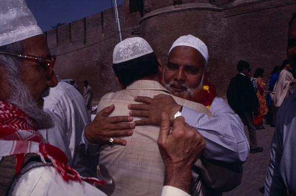 PAKISTAN, Punjab, Lahore, Devout Muslims saying their goodbyes before departing on pilgrimage to Mecca.