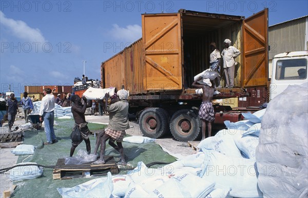 SOMALIA, Mogadishu, Loading French food aid of wheat flour onto truck for distribution from Mogadishu port.