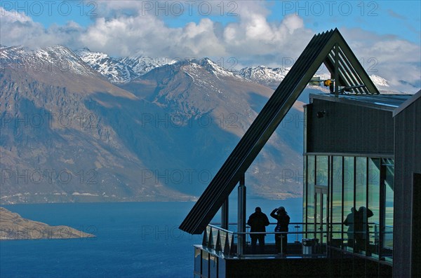 NEW ZEALAND, SOUTH ISLAND, OTAGO, "QUEENSTOWN, VIEW OF THE REMARKABLES MOUNTAINS AND LAKE WAKATIPU FROM THE SKYLINE RESTAURANT,CAFE AND GONDOLA COMPLEX ON BEN LOMOND ABOVE QUEENSTOWN."