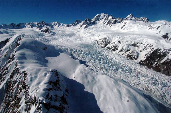 NEW ZEALAND, SOUTH ISLAND, WEST COAST, "MOUNT COOK NATIONAL PARK, WEST COAST AERIAL VIEW OF BALFOUR GLACIER (BELOW RIGHT) AND NEW ZEALANDS HIGHEST MOUNTAIN MOUNT COOK (TOP RIGHT WEST FACE) AND MOUNT TASMAN TO MOUNT COOKS LEFT. BELOW CROZET PEAK AND MOUNT DU FRESNE."