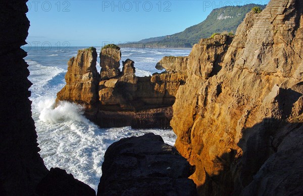 NEW ZEALAND, SOUTH ISLAND, PUNAKAIKI, "GEOLOGICAL FEATURED ROCKS CALLED THE PANCAKE ROCKS AT DOLOMITE POINT, PUNAKAIKI ON THE SOUTH ISLAND WEST COAST."
