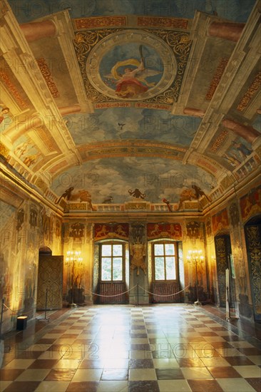 AUSTRIA, Salzburg, "Hellbrunn Palace, dating from early 17th c.  Interior of banqueting hall with  trompe l’oeil painting covering walls and ceiling and chequered floor.  "