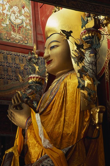 CHINA, Beijing, Part view of the Maitreya future Buddha twenty-six metre high standing figure in the Wanfuge Lama temple.