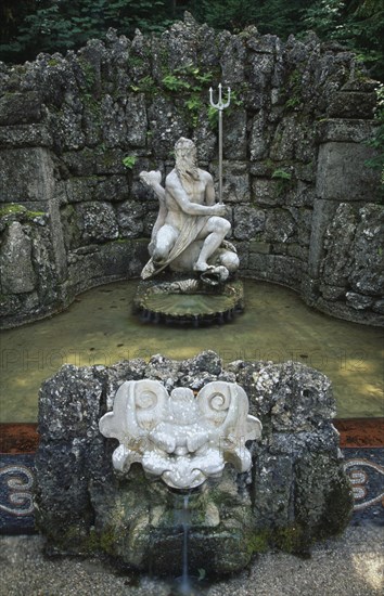 AUSTRIA, Salzburg, Fountain with statue of Neptune in Hellbrunn Palace Gardens known for the ‘surprise’ fountains in its grounds dating from the 17th c.