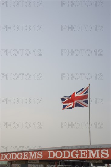 ENGLAND, West Sussex, Littlehampton, Harbour Park Dodgems amusement ride with detail of sign and Union Jack Flag flying from roof