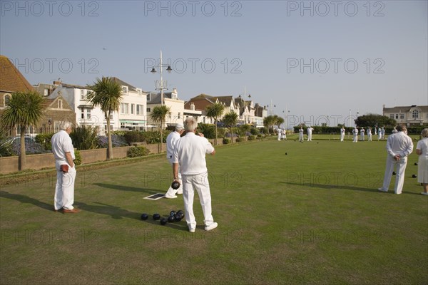 ENGLAND, West Sussex, Bognor Regis, Men playing a game of bowls on green