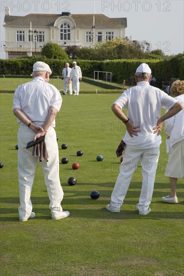 ENGLAND, West Sussex, Bognor Regis, Men and women playing a game of bowls on beach front green