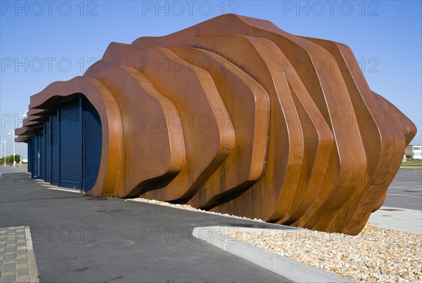 ENGLAND, West Sussex, Littlehampton, The rusted metal structure of the fish and seafood restaurant the East Beach Cafe designed by Thomas Heatherwick on the promenade