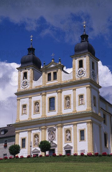 AUSTRIA, Salzburg, Maria Plain church of pilgrimage.  Baroque exterior facade with double tower and statues of the four evangelists and the Virgin and Child above the entrance.