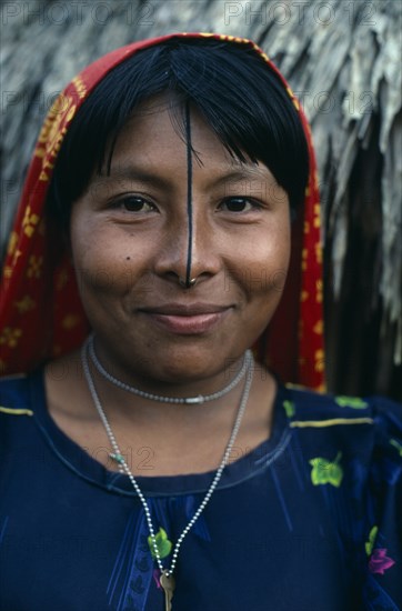 PANAMA, San Blas Islands Ustupu, Kuna Indians, Portrait of smiling Kuna woman with gold nose ring and black line drawn along length of nose thought to enhance beauty. Cuna Caribbean American Central America Female Women Girl Lady Hispanic Latin America Latino Panamanian West Indies