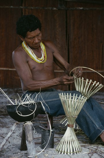 COLOMBIA, North West Amazon, Tukano Indigenous People, Makuna man making cane cooking pot stands. Tukano  Makuna Indian North Western Amazonia American Colombian Columbia Hispanic Indegent Latin America Latino Male Men Guy South America Tukano