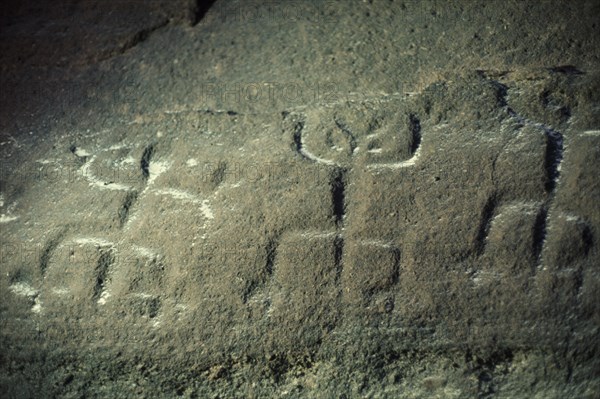 COLOMBIA, North West Amazon, Tukano Indigenous People, Barasana.  Detail of rock engravings depicting ancient dancing animal spirits in old red sandstone strata at edge of rio Piraparana. Tukano sedentary tribe North Western Amazonia American Colombian Columbia Hispanic History Indegent Latin America Latino South America Tukano